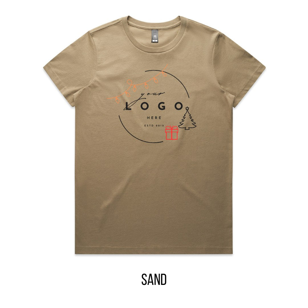 Chrissy Tree & Prezzie Tee mock-up on Sand